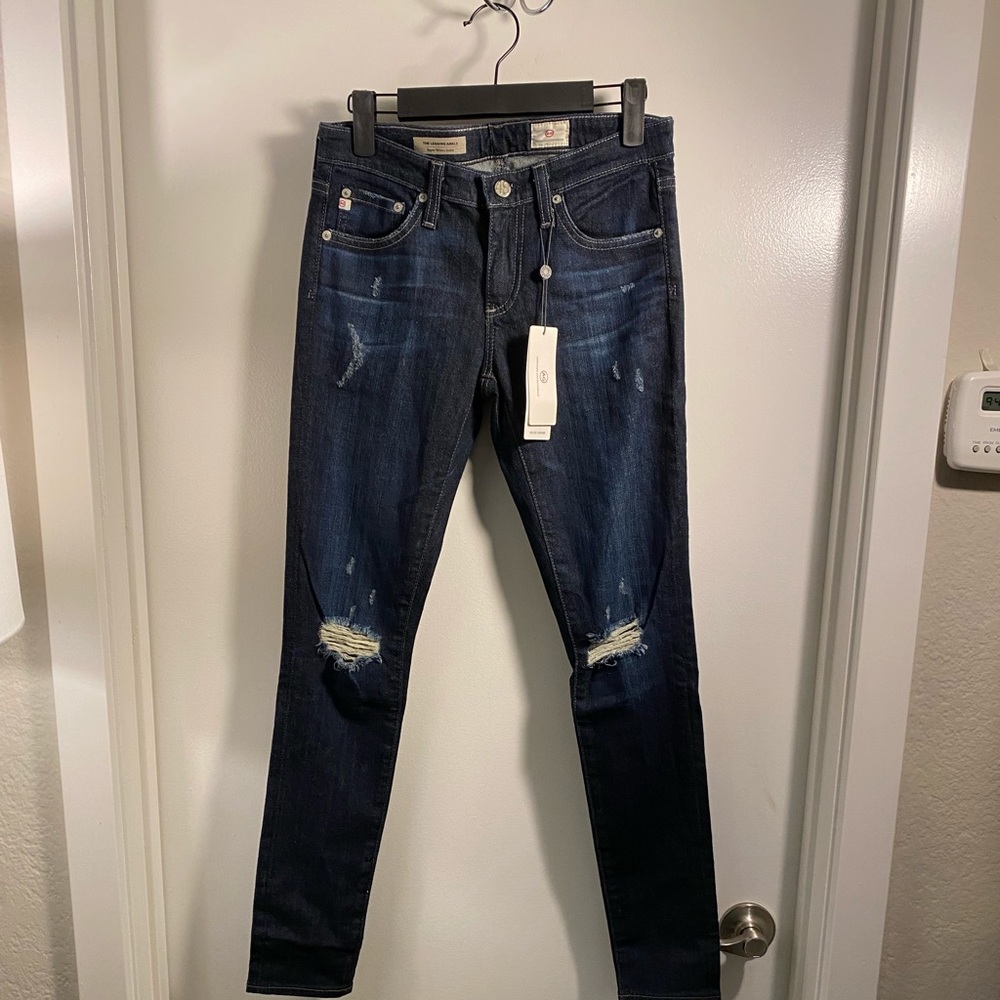 A.G. The Legging Ankle in dark wash with rips. Size 26 NWT never worn retail 235